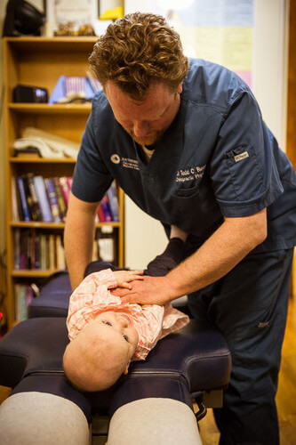 Pediatric Chiropractor in Andersonville provides gentle adjustment for Baby